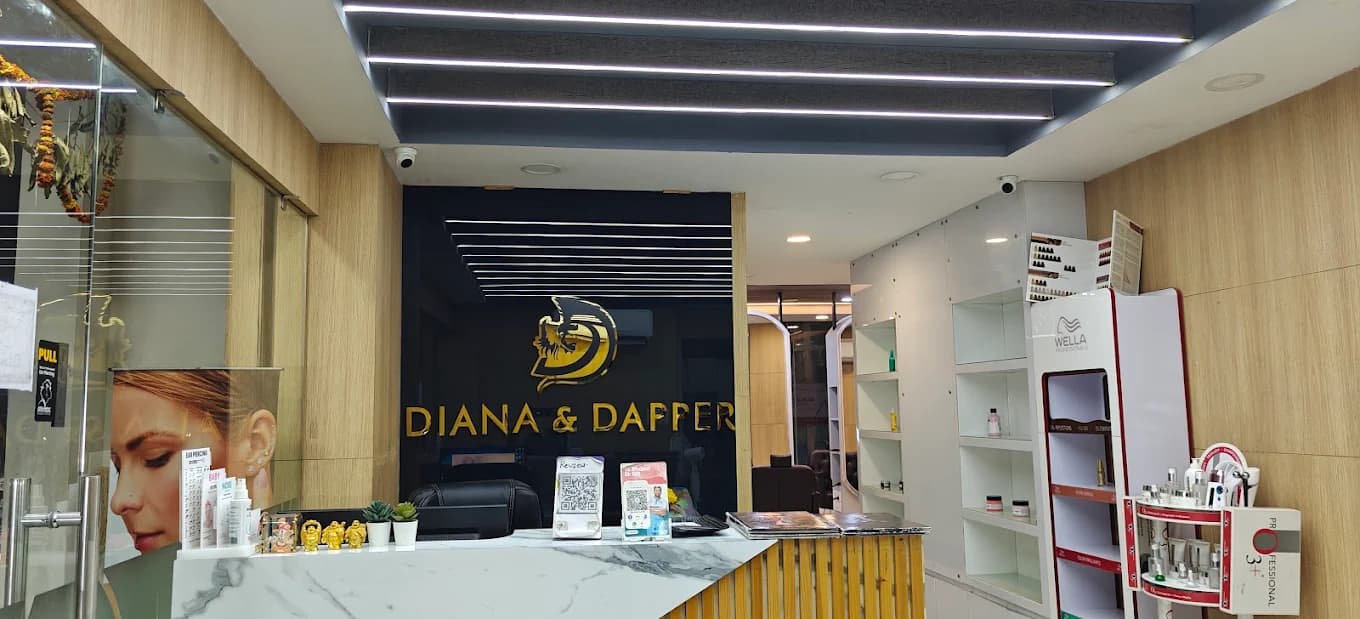 Malkajgiri salon: backlit Diana & Dapper signage in gold lettering