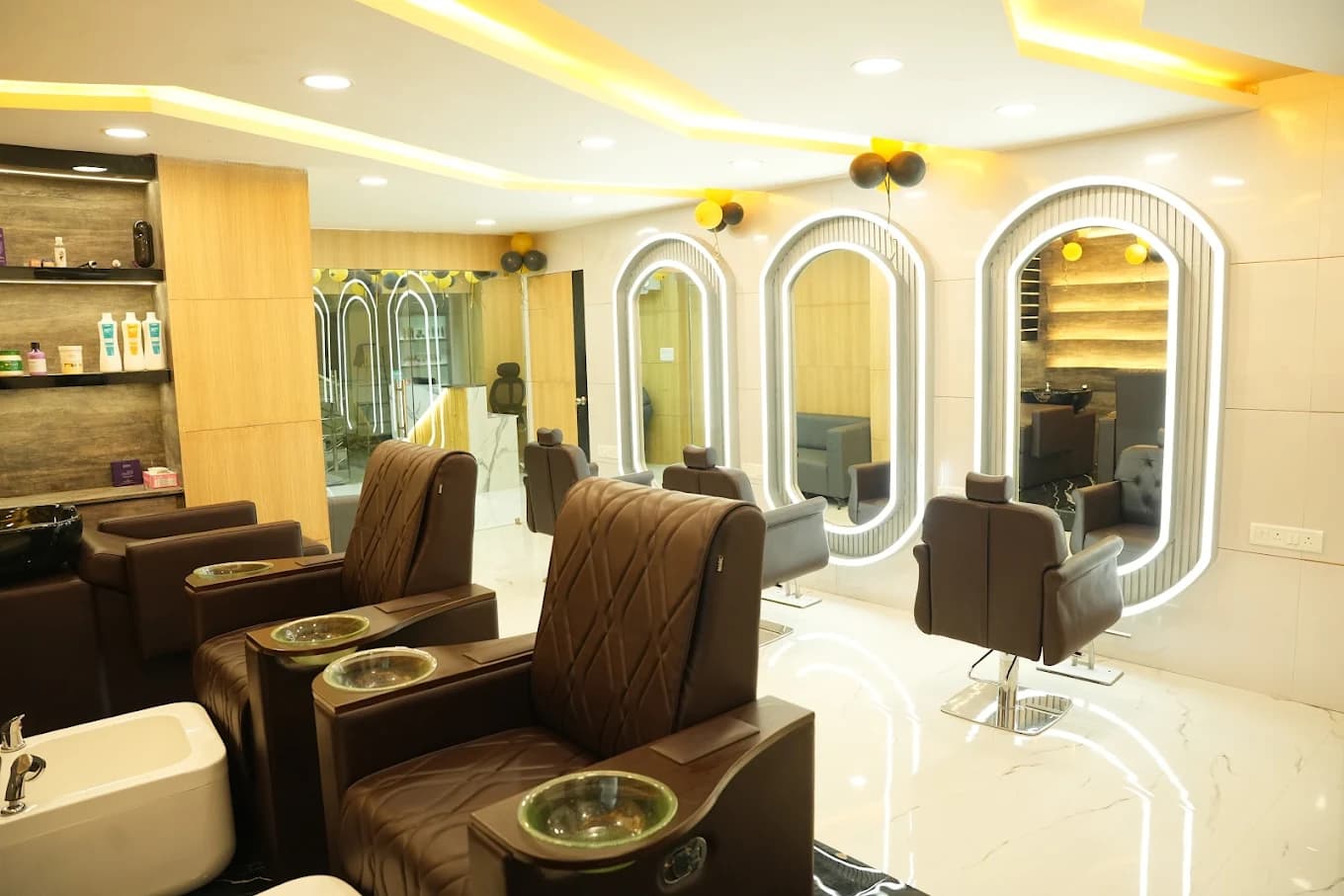 Malkajgiri salon: pedicure lounge with oval mirrors and marble flooring