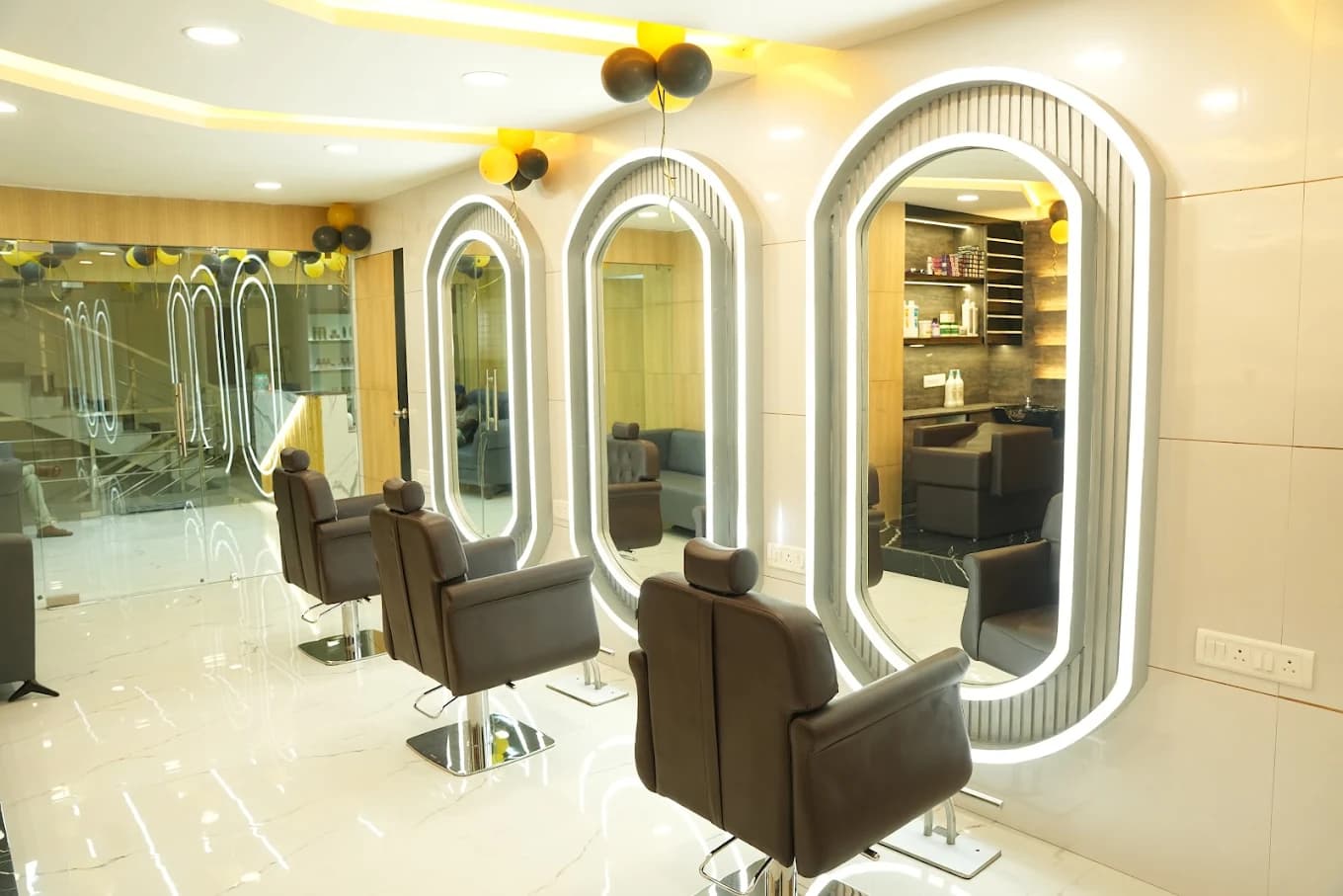 Malkajgiri salon: haircut stations with curved mirrors and lighting