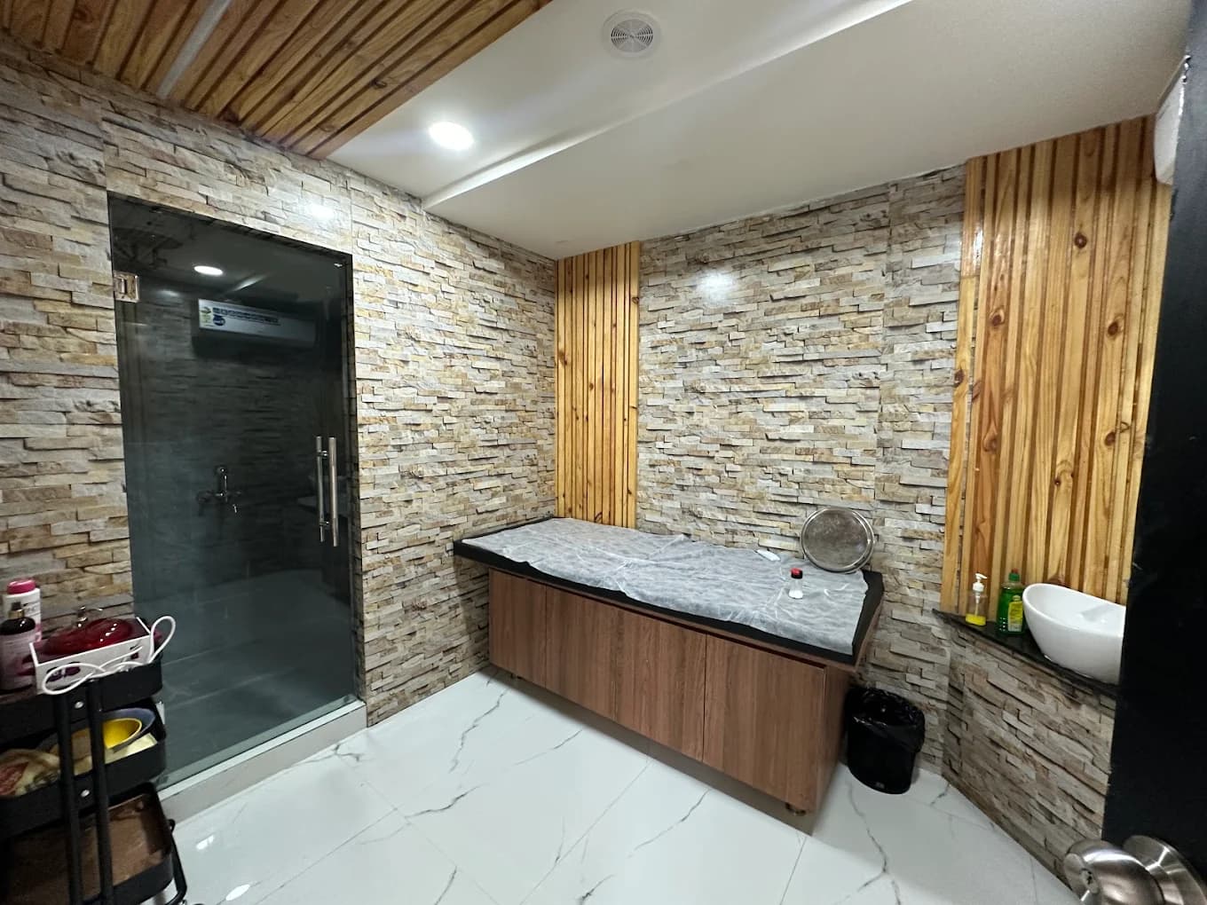 Malkajgiri salon: bridal makeup room with stone walls and warm lighting