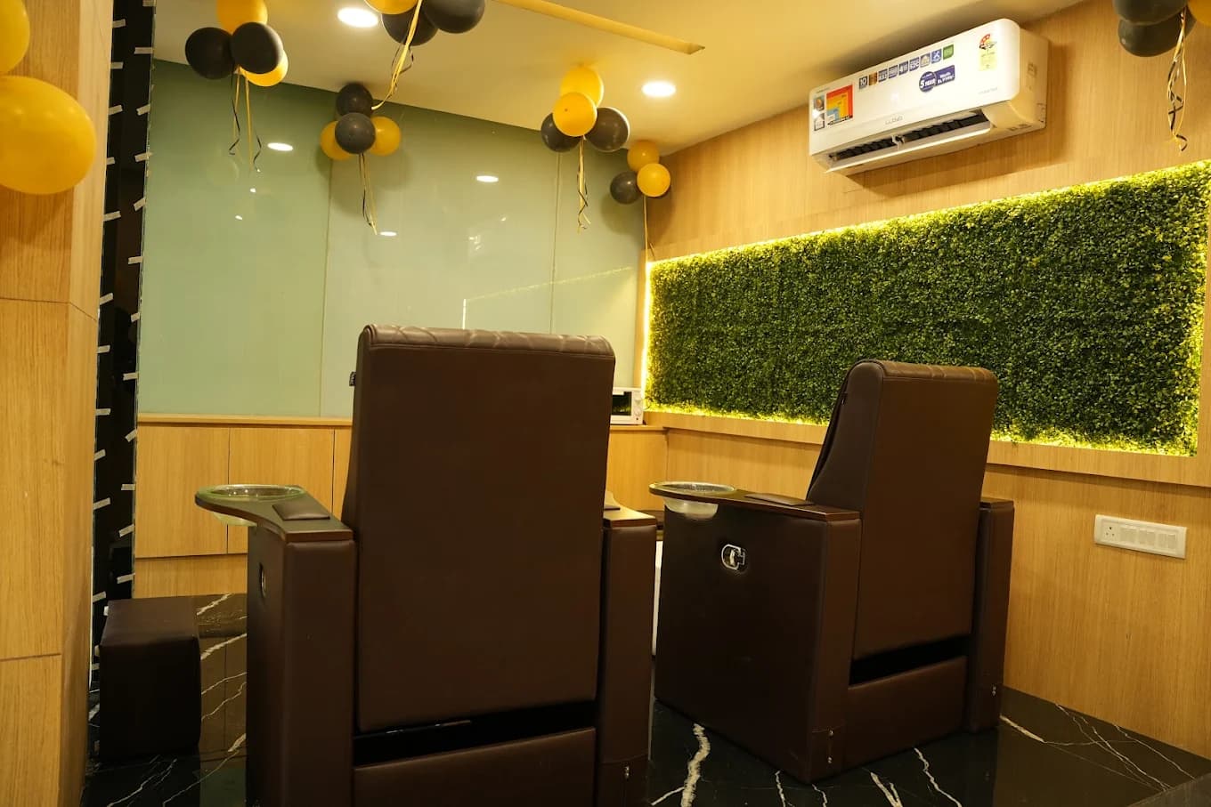 Malkajgiri salon: manicure and pedicure stations with green walls and opening day balloons