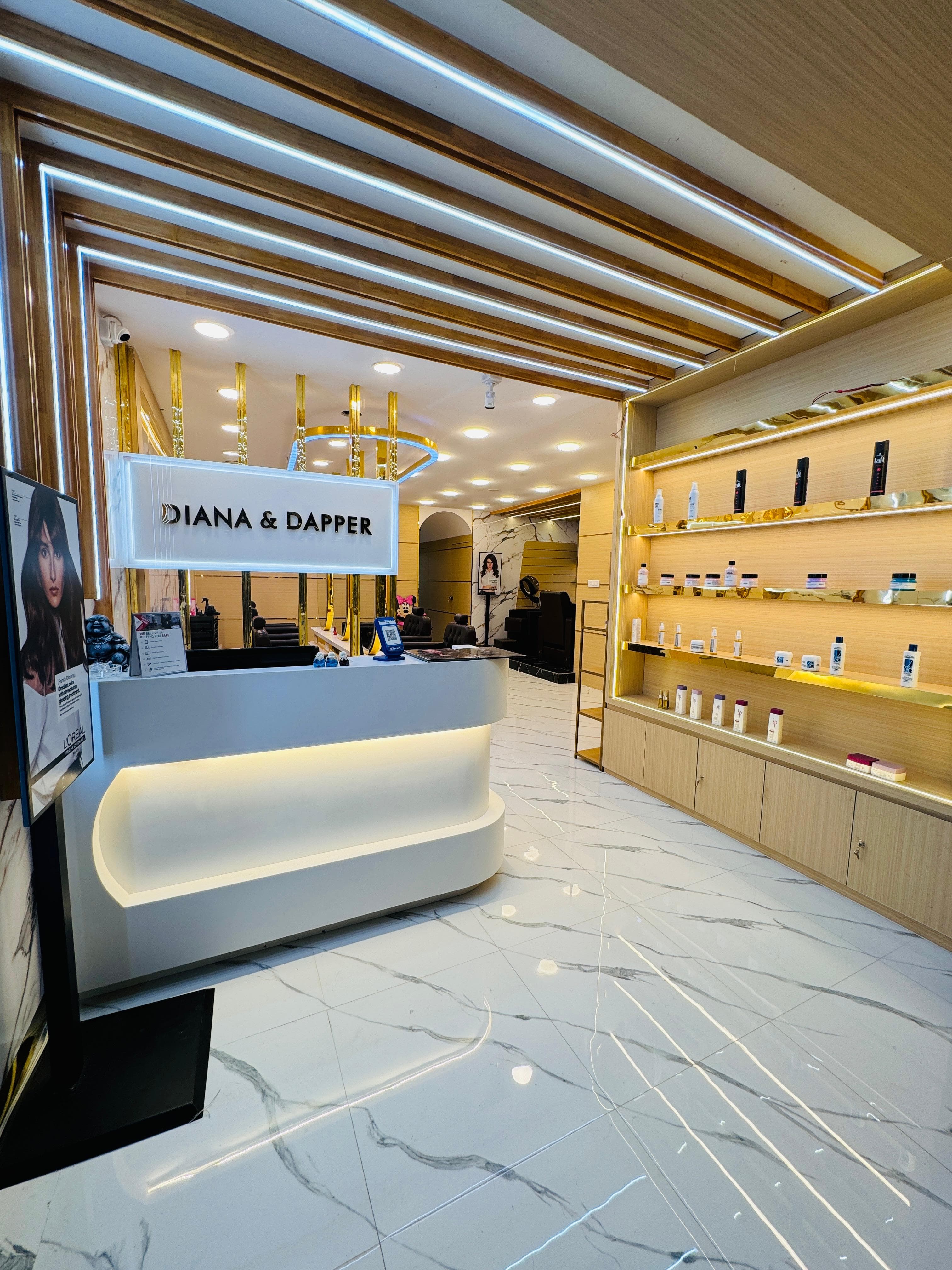 Sainikpuri salon: entrance signage with marble interior visible through the glass