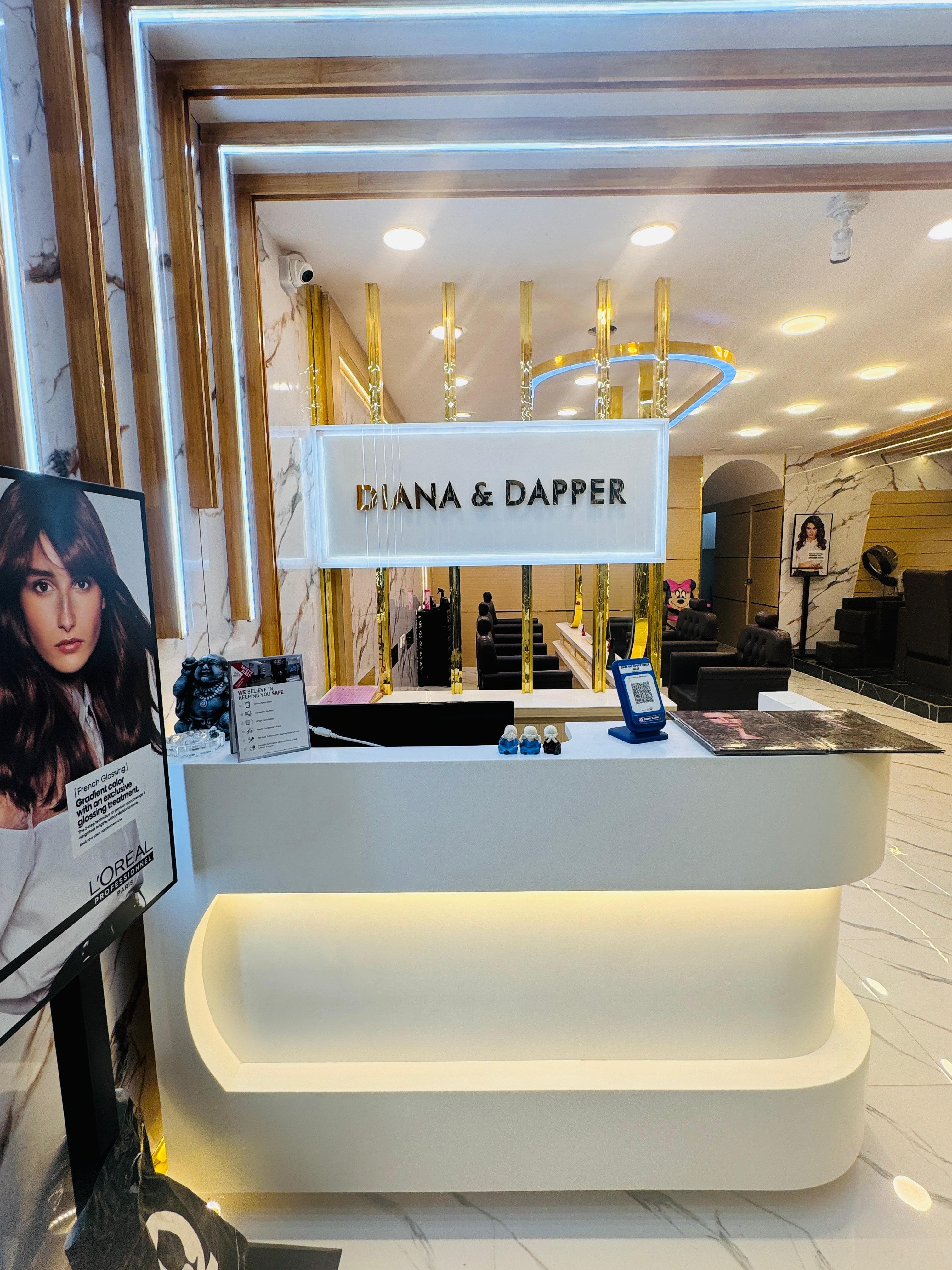 Sainikpuri salon: reception desk with Diana & Dapper signage in marble